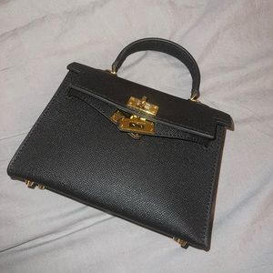 Elegant Black Handbag with Gold Accents